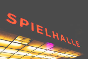 At night on the Reeperbahn - around St.Pauli the bars attract with their colorful neon sign. Spielhalle - Spielhölle? At night on the Reeperbahn - around St.Pauli the bars attract with their colorful neon sign. Spielhalle - Spielhölle?